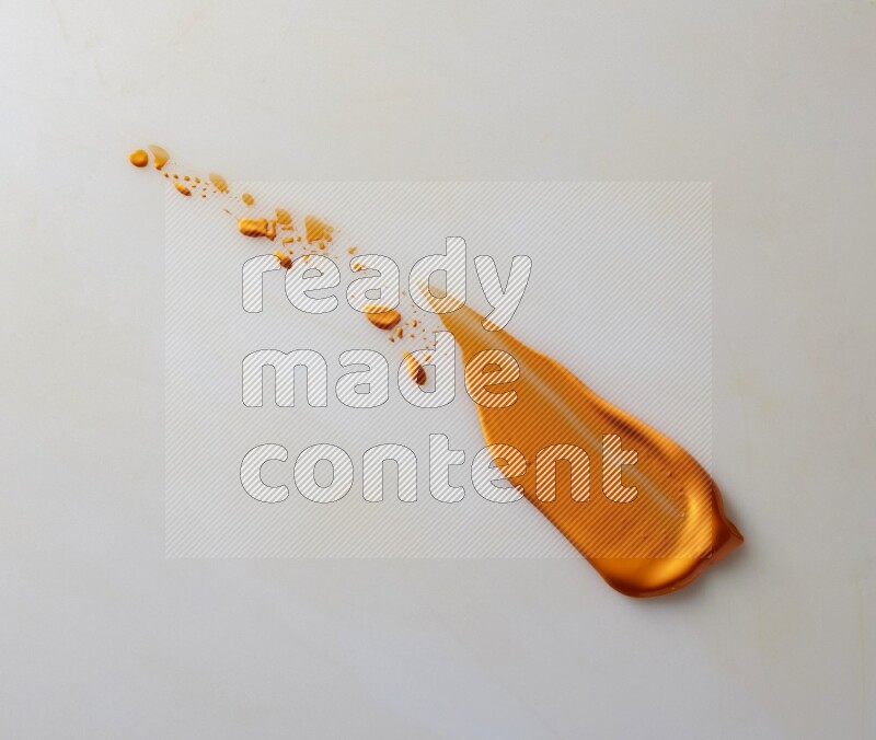 An orange straight painting knife stroke on white background