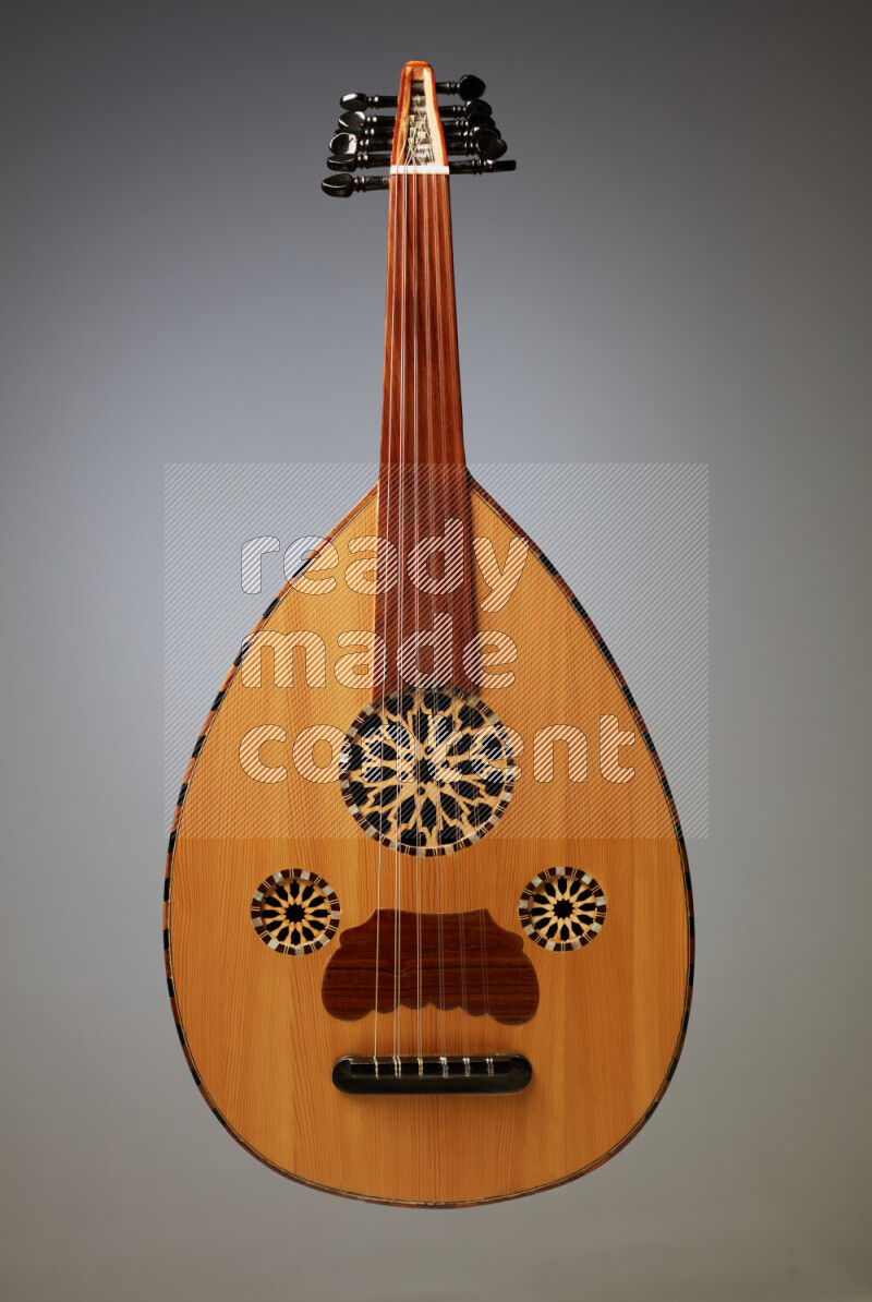 a wooden brown Oud on a gray background