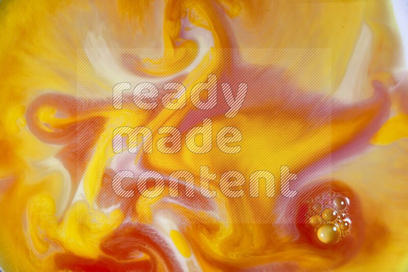 A close-up of abstract swirling patterns in orange, red and white