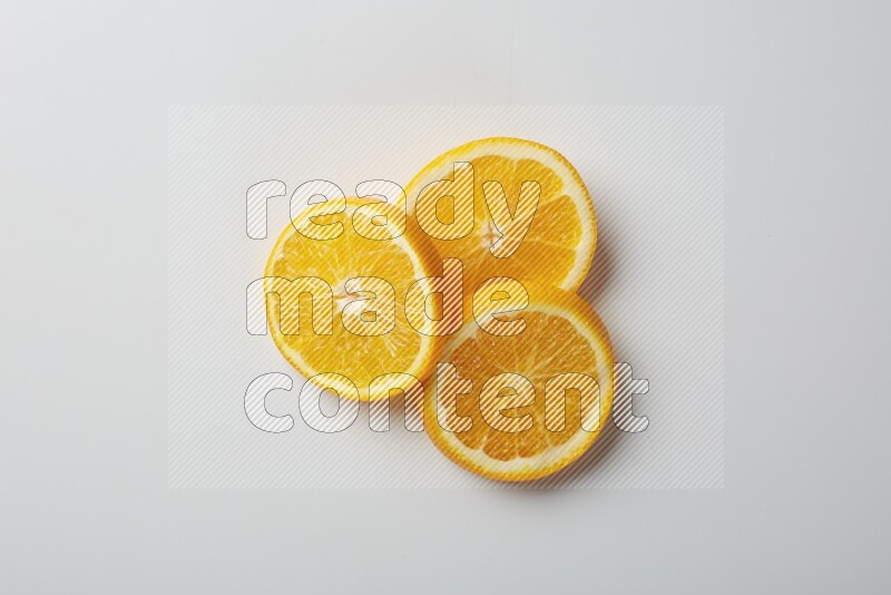 Three orange slices on a white background