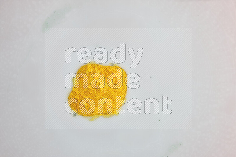 A close-up of abstract swirling patterns in yellow and white