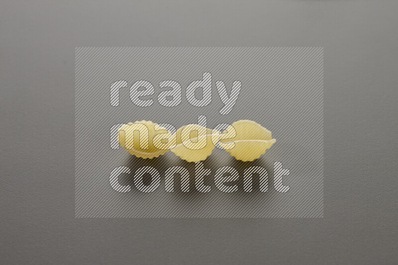 Shells pasta on grey background