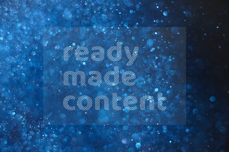 Blue glitter powder isolated on black background