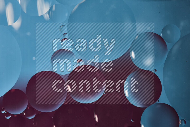 Close-ups of abstract oil bubbles on water surface in shades of blue and purple