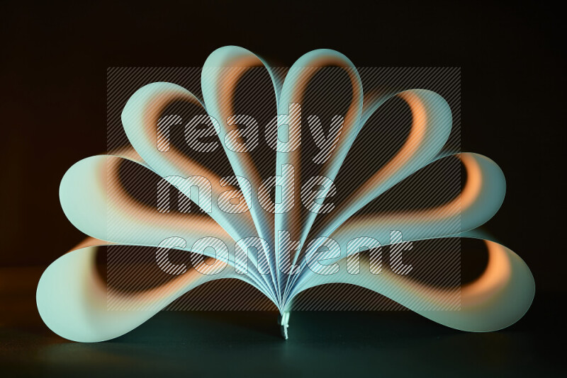An abstract art piece displaying smooth curves in yellow and green gradients created by colored light