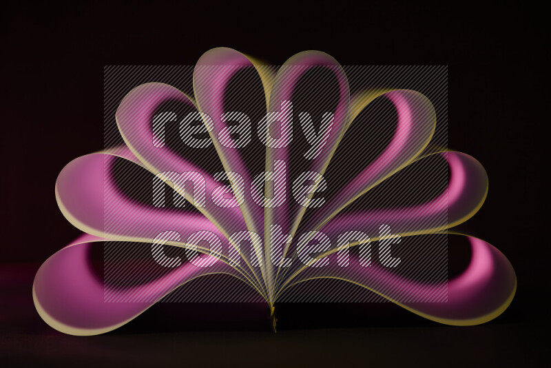 An abstract art piece displaying smooth curves in pink gradients created by colored light