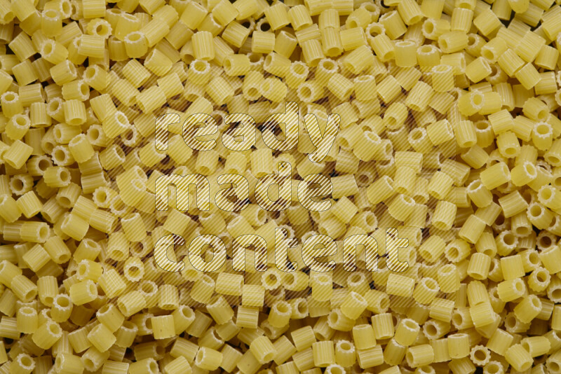 Small rings pasta on grey background