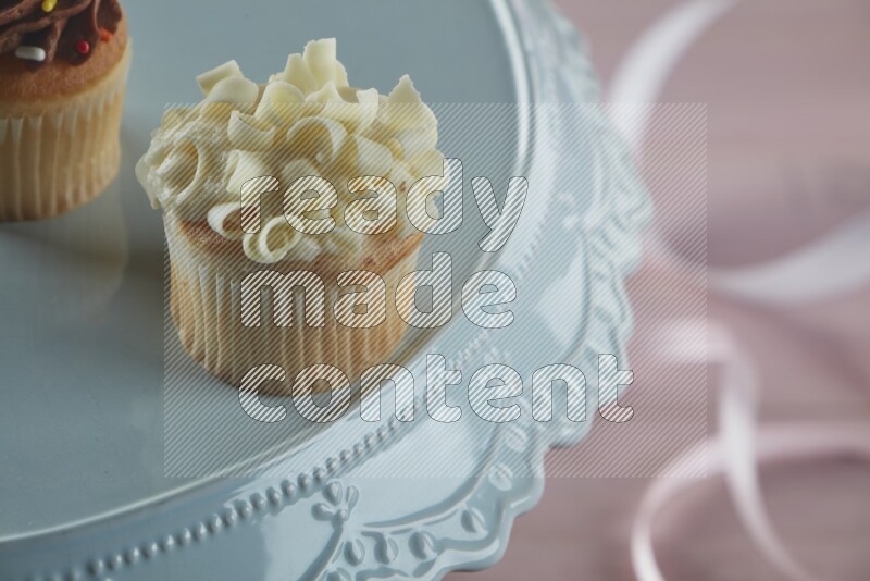 Vanilla mini cupcake topped with white chocolate curls