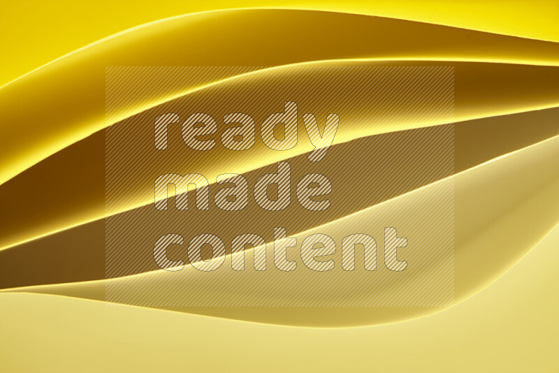 This image showcases an abstract paper art composition with paper curves in gold gradients created by colored light