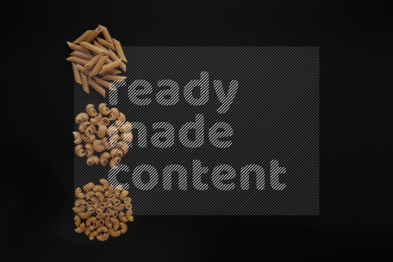 Different pasta types in 3 bunches on black background