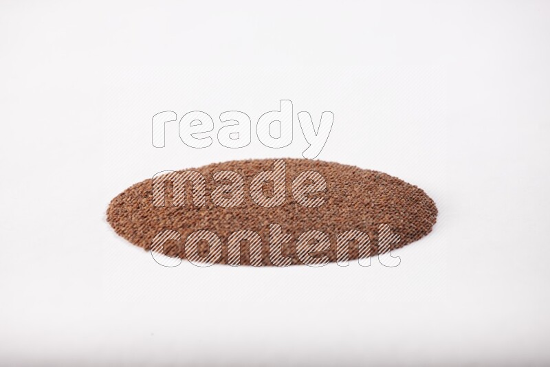 Garden cress seeds in a circle shape on a white flooring