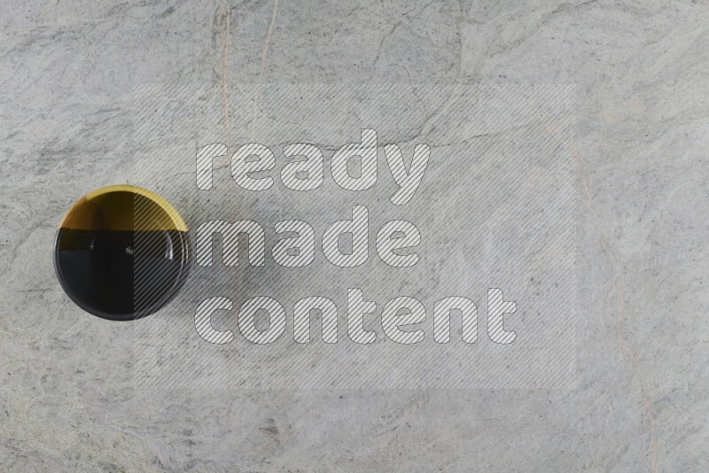 A multicolored pottery Bowl on grey marble background