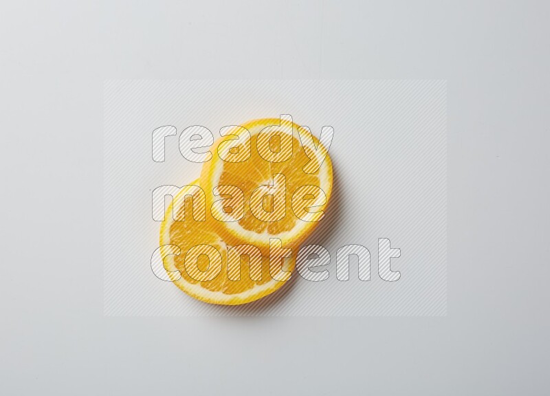 Two orange slices on white background