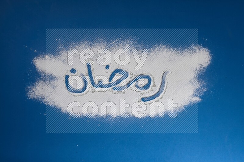 A word written with white powder on blue background