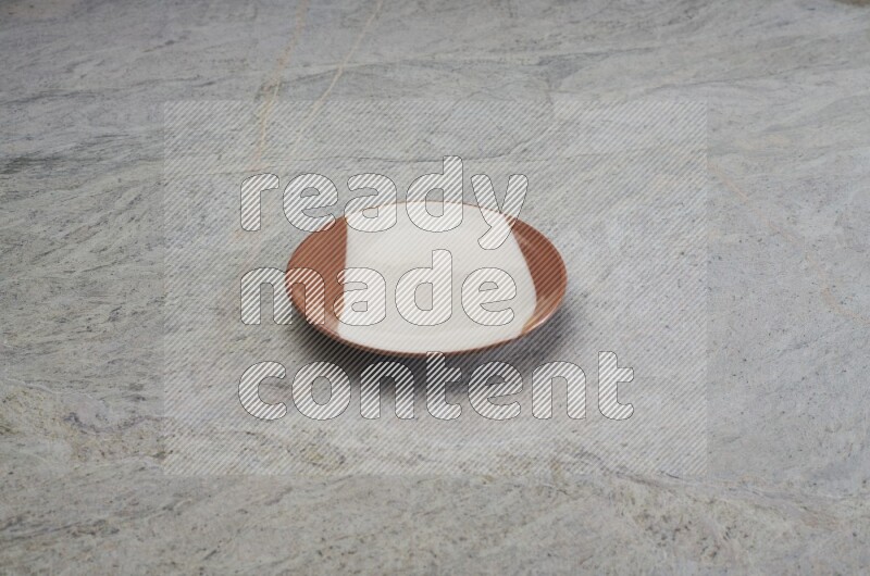 Multicolored Pottery Plate On Grey Marble Flooring