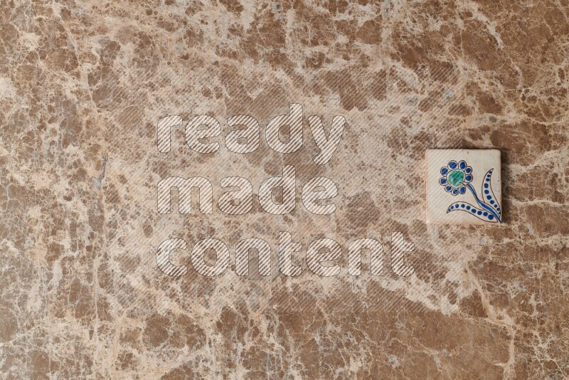 A decorative coaster on beige marble background