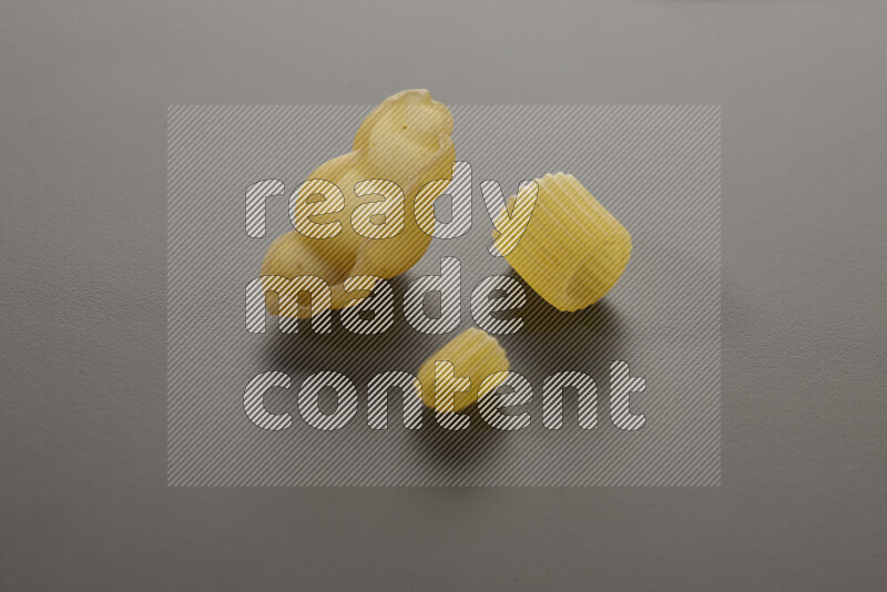 Different pasta types on grey background
