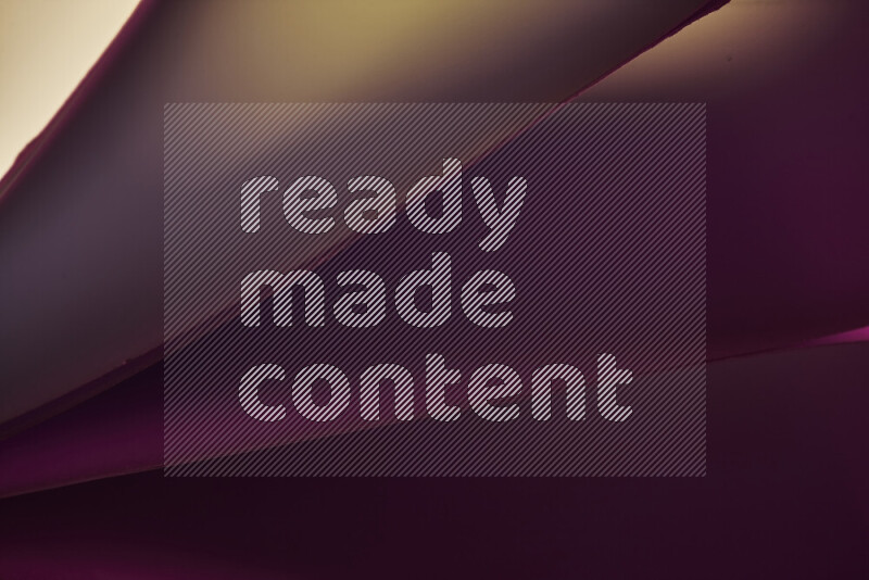 فن تجريدي يعرض منحنيات مع تدرجات الألوان الدافئة والباردة مكونه بضوء ملون