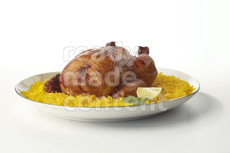 yellow  basmati Rice with kabsa chicken pieces on a white plate with a silver rim direct on white background