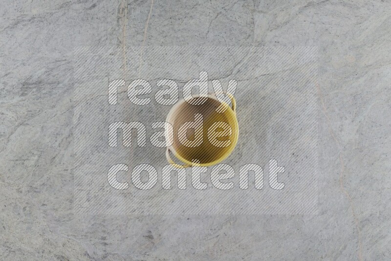 A multicolored pottery Bowl on grey marble background