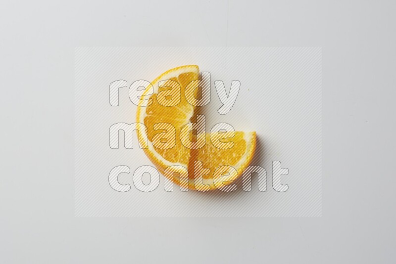 Two halves of an orange slices on white background