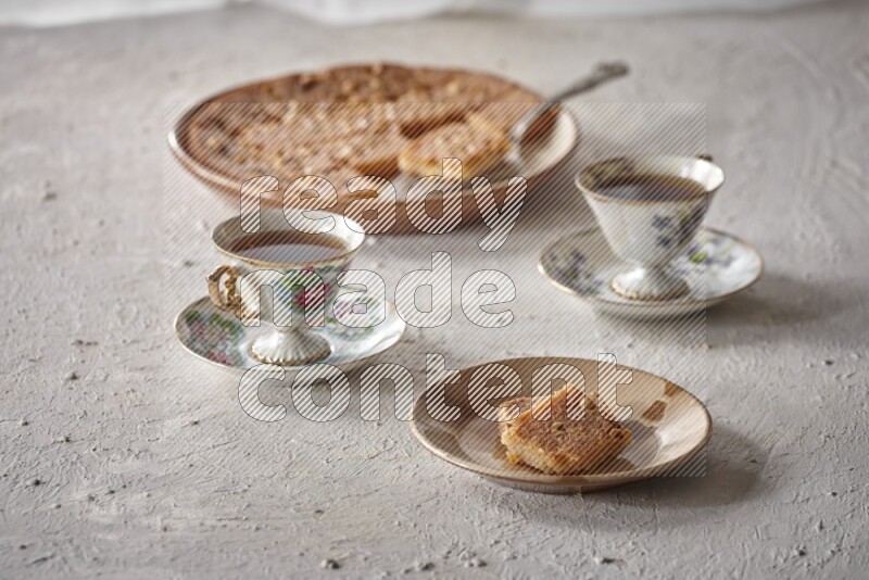 Basbousa with tea in a light setup