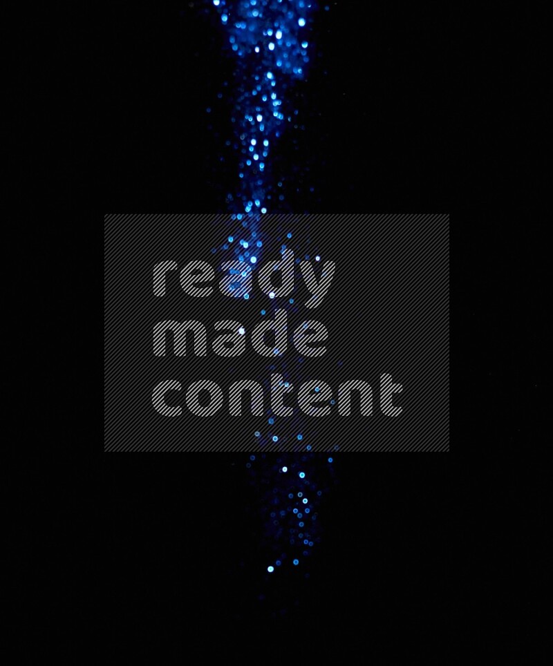 Blue glitter powder isolated on black background