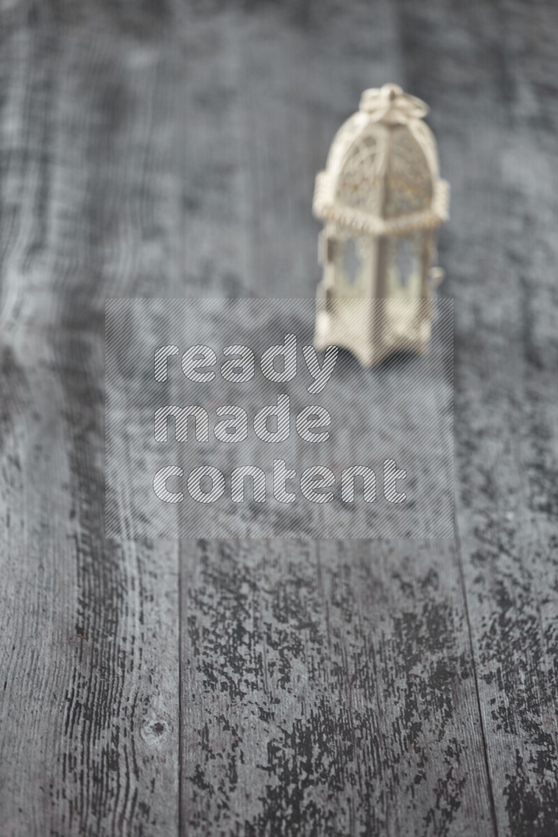 A lantern placed on a wooden background