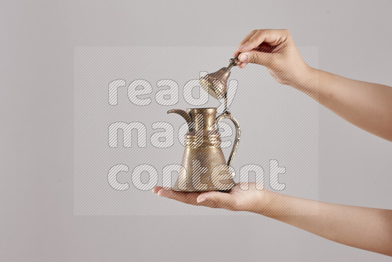 Woman hands holding different metal essentials in different positions