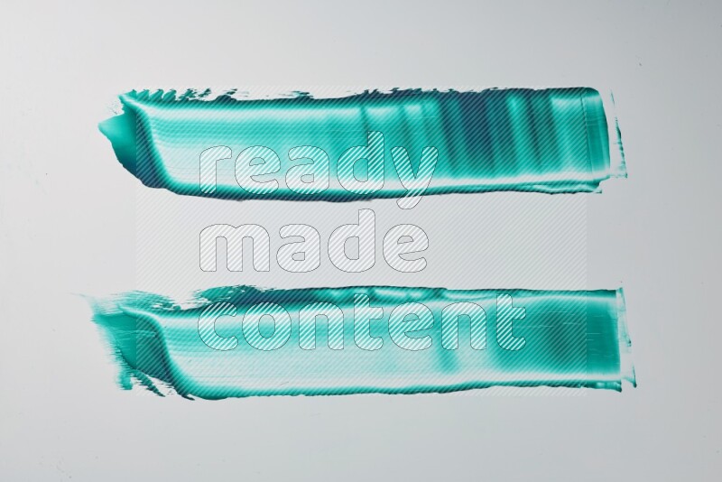 Turquoise painting knife strokes on white background