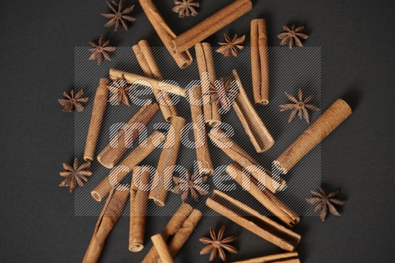 Cinnamon sticks and star anise on black background