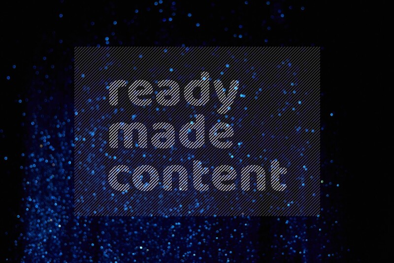 Blue glitter powder isolated on black background