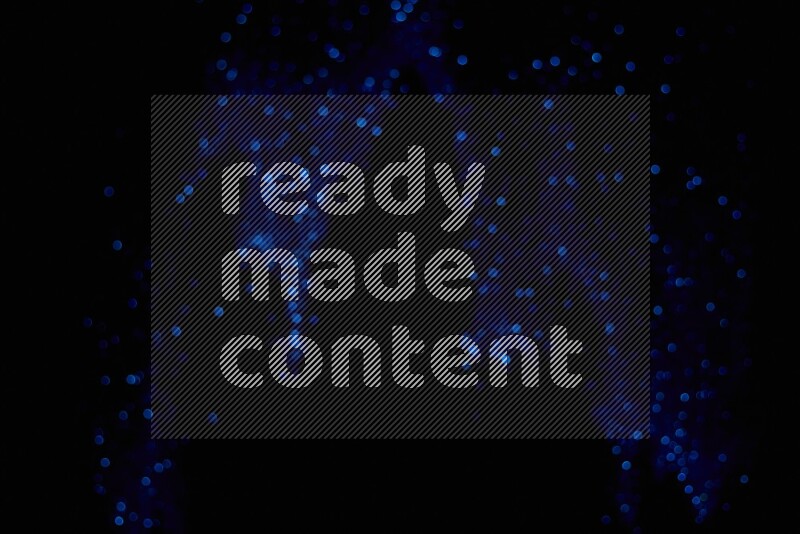 Blue glitter powder isolated on black background