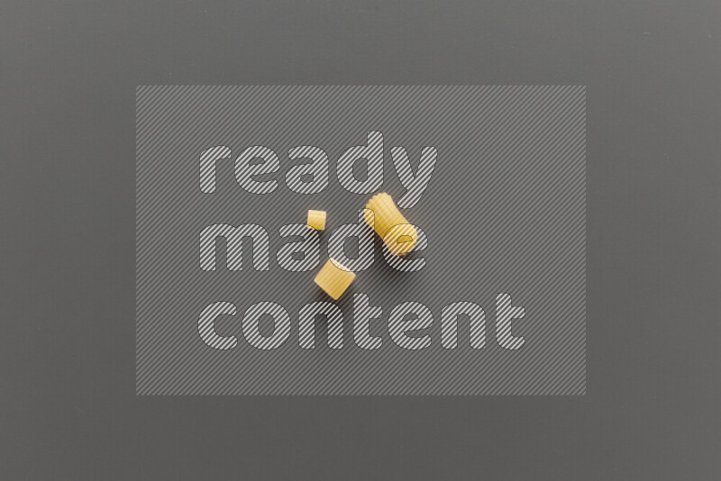 Different pasta types on grey background