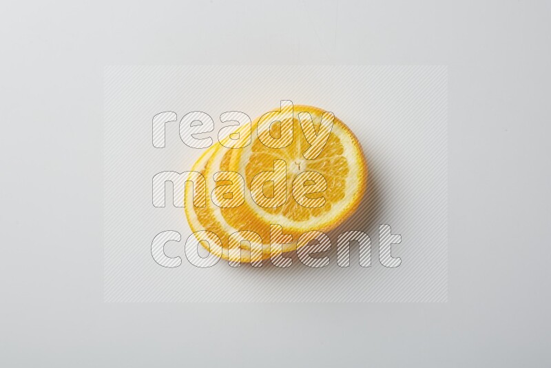 Three orange slices on a white background