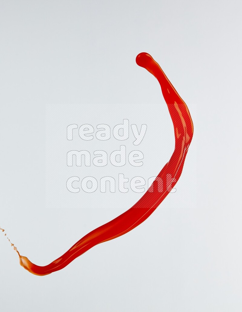 Orange liquid splash and drops on white background