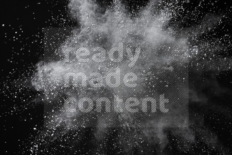 White powder explosion on black background