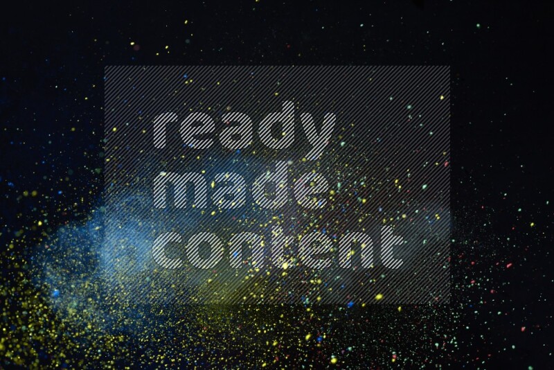 Colorful powder explosion on black background