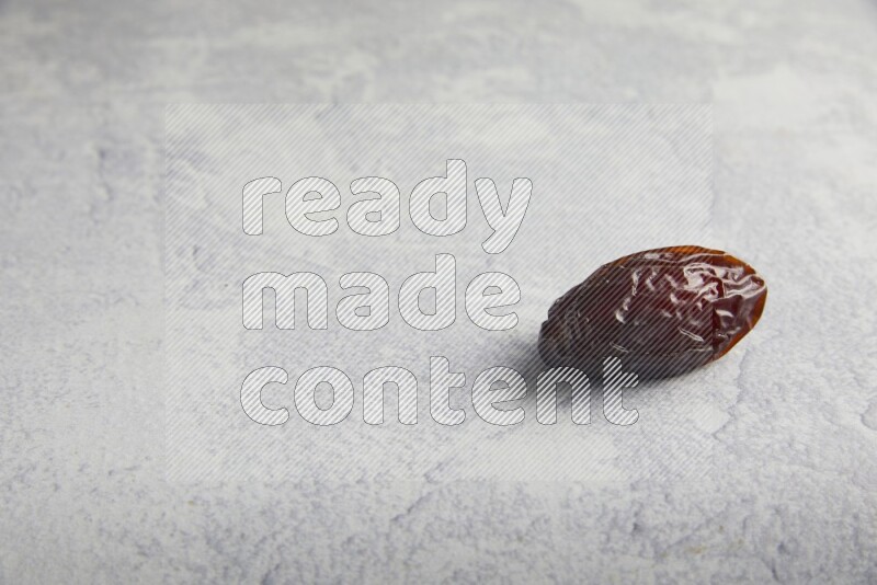 one madjoul date on a light grey background