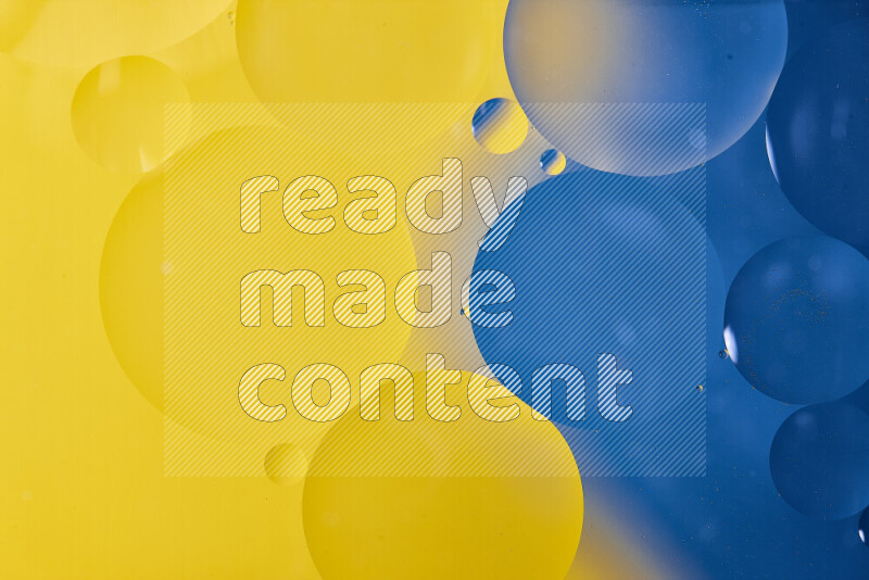 Close-ups of abstract oil bubbles on water surface in shades of blue and yellow