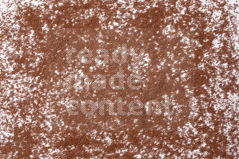 Garden cress seeds spread on a white flooring