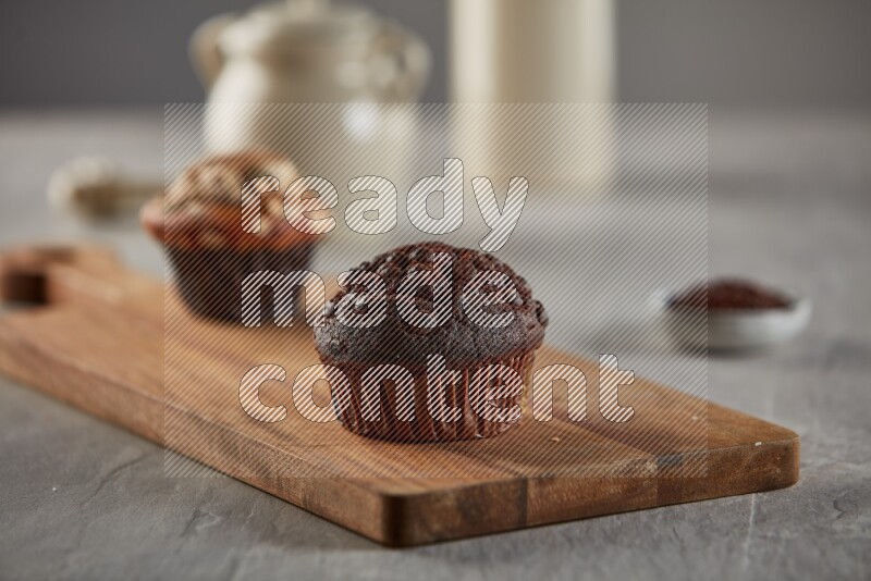 Chocolate cupcake on a wooden board