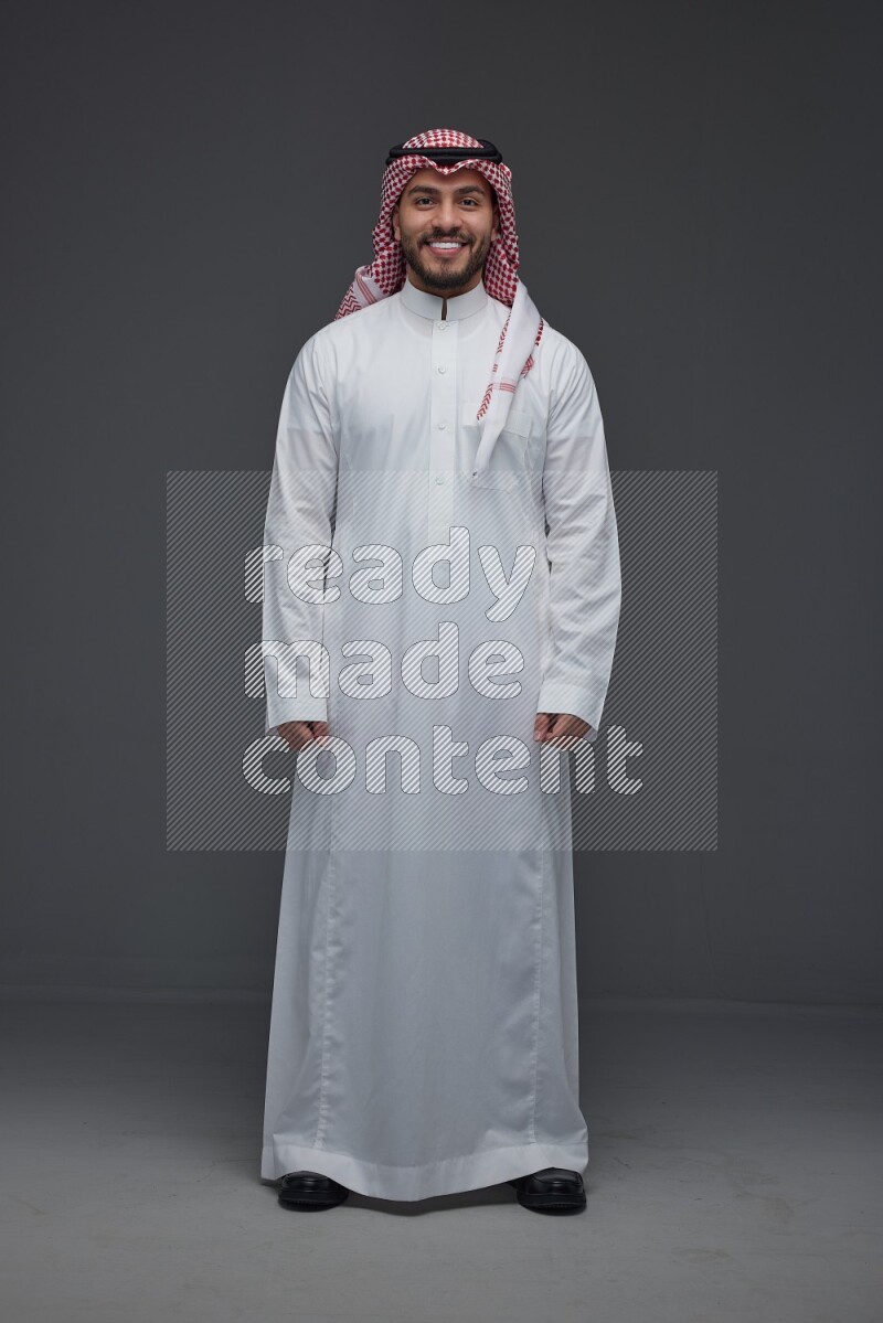 A Saudi man wearing Thobe and Shmagh standing in different poses eye level on a gray background