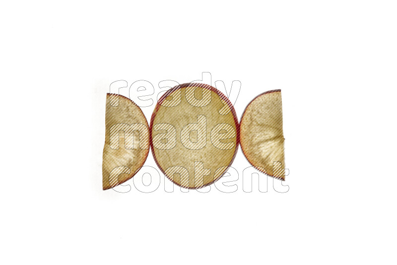 Plum slices on illuminated white background