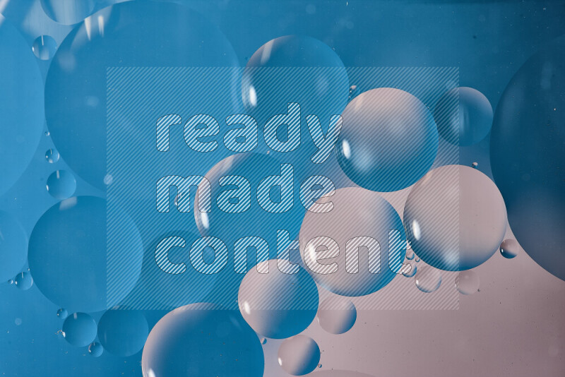 Close-ups of abstract oil bubbles on water surface in shades of white and blue