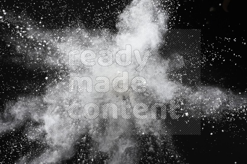 White powder explosion on black background