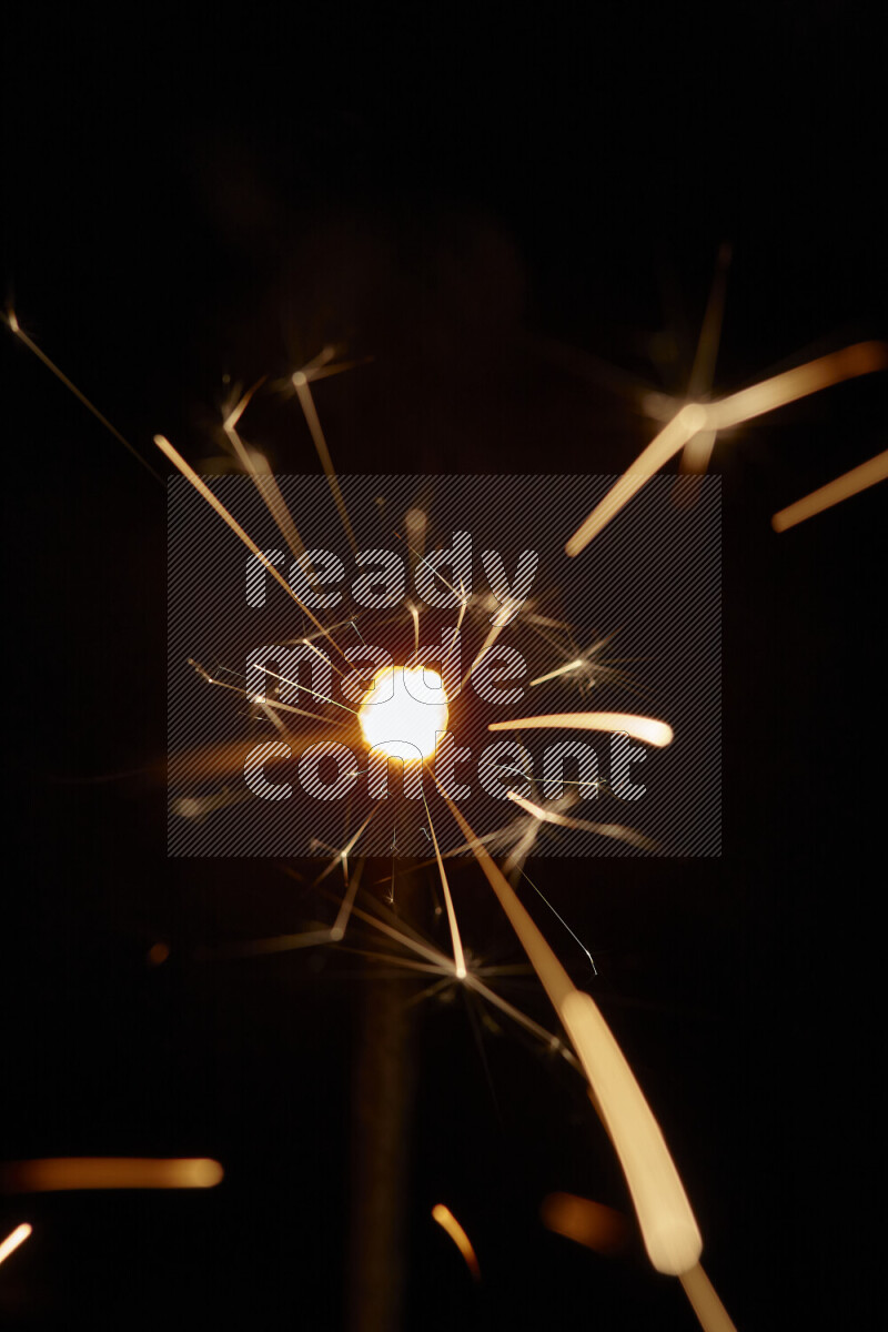 A close-up image of sparkler candle isolated on black background