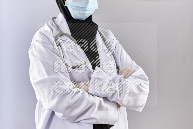 Female doctor wearing an abaya and medical attire in different positions