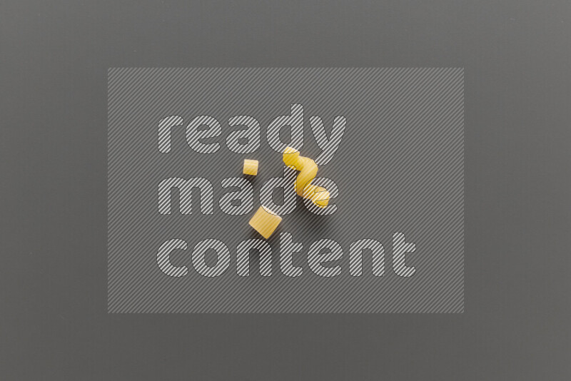 Different pasta types on grey background
