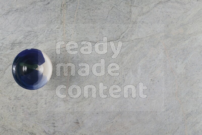 A multicolored pottery Bowl on grey marble background